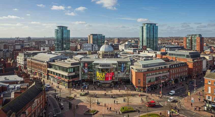 Comfortable coach bus traveling from Birmingham city center to Heathrow Airport