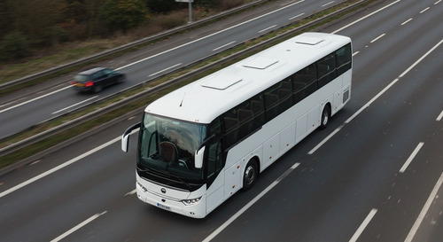 Modern luxury airport bus on M1 motorway heading to Luton Airport with comfortable seating visible through windows